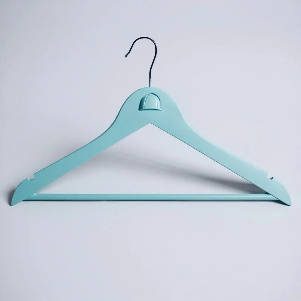 Teal Hanger with Angled Shoulders for the Equestrian attire adorned with helmet.